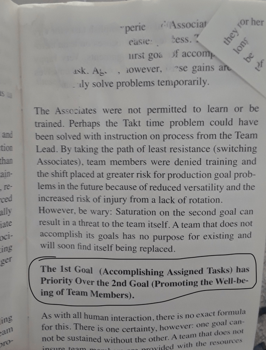 Photo of a page from Tesla's manager handbook, which states that accomplishing assigned takss should take priority over promoting the well-being of team members